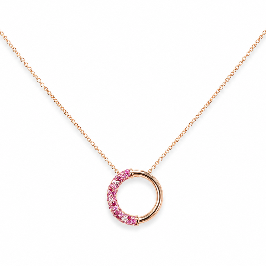 A delicate 14k rose gold necklace featuring a half-circle open pendant embellished with small pink natural shappires and diamonds.