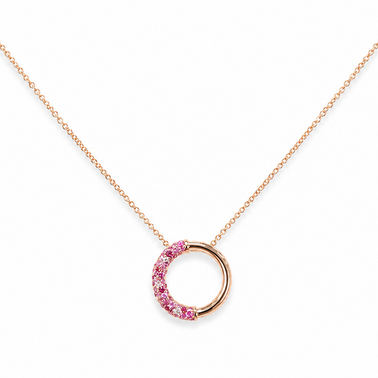 A delicate 14k rose gold necklace featuring a half-circle open pendant embellished with small pink natural shappires and diamonds.